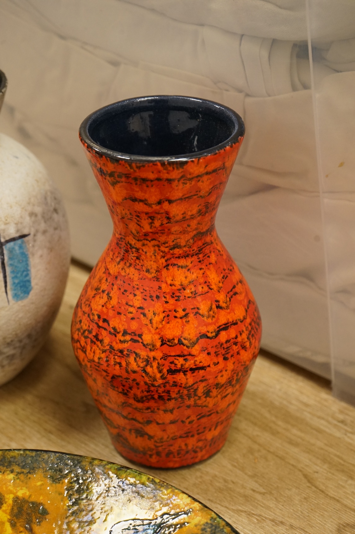A collection of studio ceramics and pottery to include a Zsolnay vase and a Lyn Alves hexagonal dish